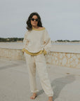 Matching neutral sweatsuit set for women.