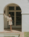 Mid-length muslin beach shorts for women in brown.