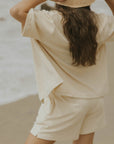 Neutral matching beachwear set for women.