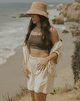 Neutral matching beachwear set for women.