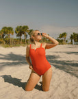 Cute modest red one piece swimsuit.