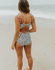 Cute modest one piece swimsuit, with ribbed texture and black and white cheetah print. Nursing Friendly