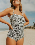 Cute modest one piece swimsuit, with ribbed texture and black and white cheetah print. Nursing Friendly