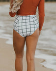 Modest white high waisted bikini bottoms.