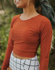 Cute modest orange long sleeve tankini top with full coverage bikini bottoms.