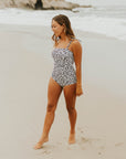 Cute modest one piece swimsuit, with ribbed texture and black and white cheetah print. Nursing Friendly