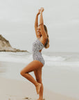 Cute modest one piece swimsuit, with ribbed texture and black and white cheetah print. Nursing Friendly