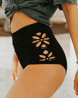Modest black high waisted bikini bottoms. Floral cutouts.