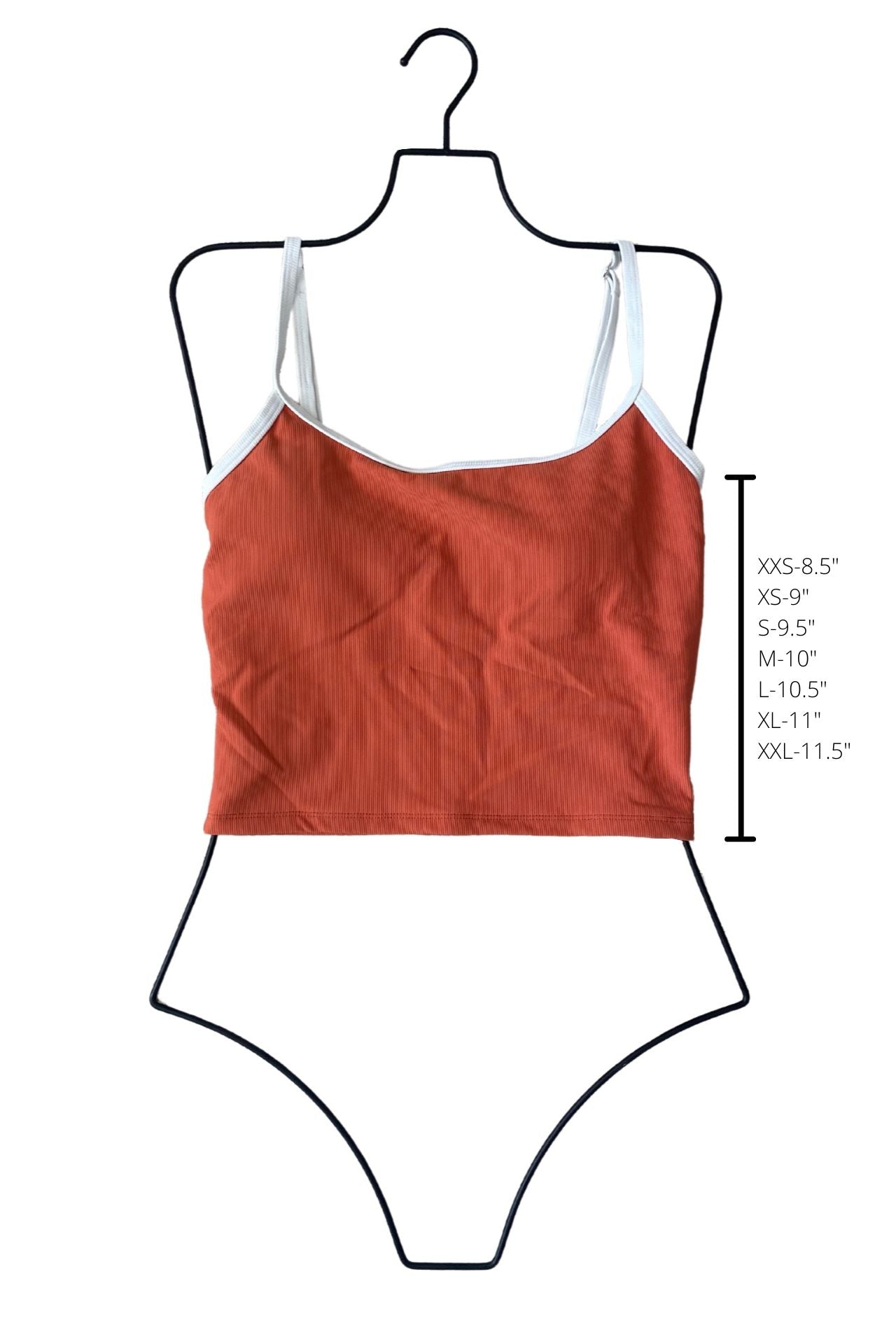 Ribbed rust-colored cropped swim top with white straps displayed on a size guide mannequin with length measurements.