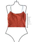 Ribbed rust-colored cropped swim top with white straps displayed on a size guide mannequin with length measurements.