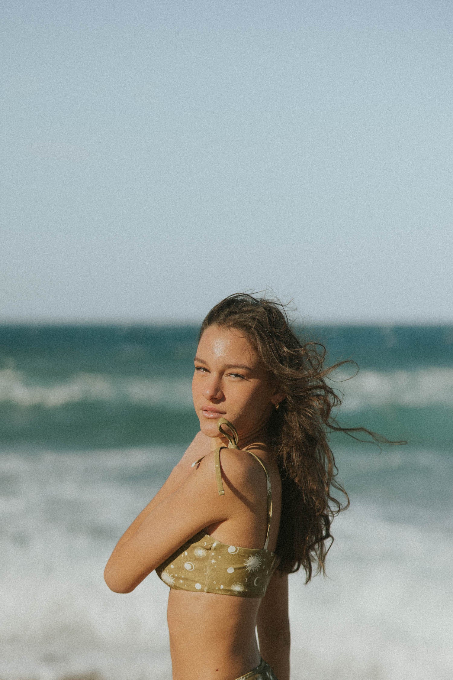 Olive green sun and moon print bikini top with tying straps
