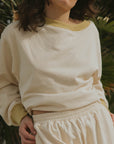 Matching neutral sweatsuit set for women.