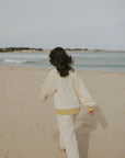Matching neutral sweatsuit set for women.