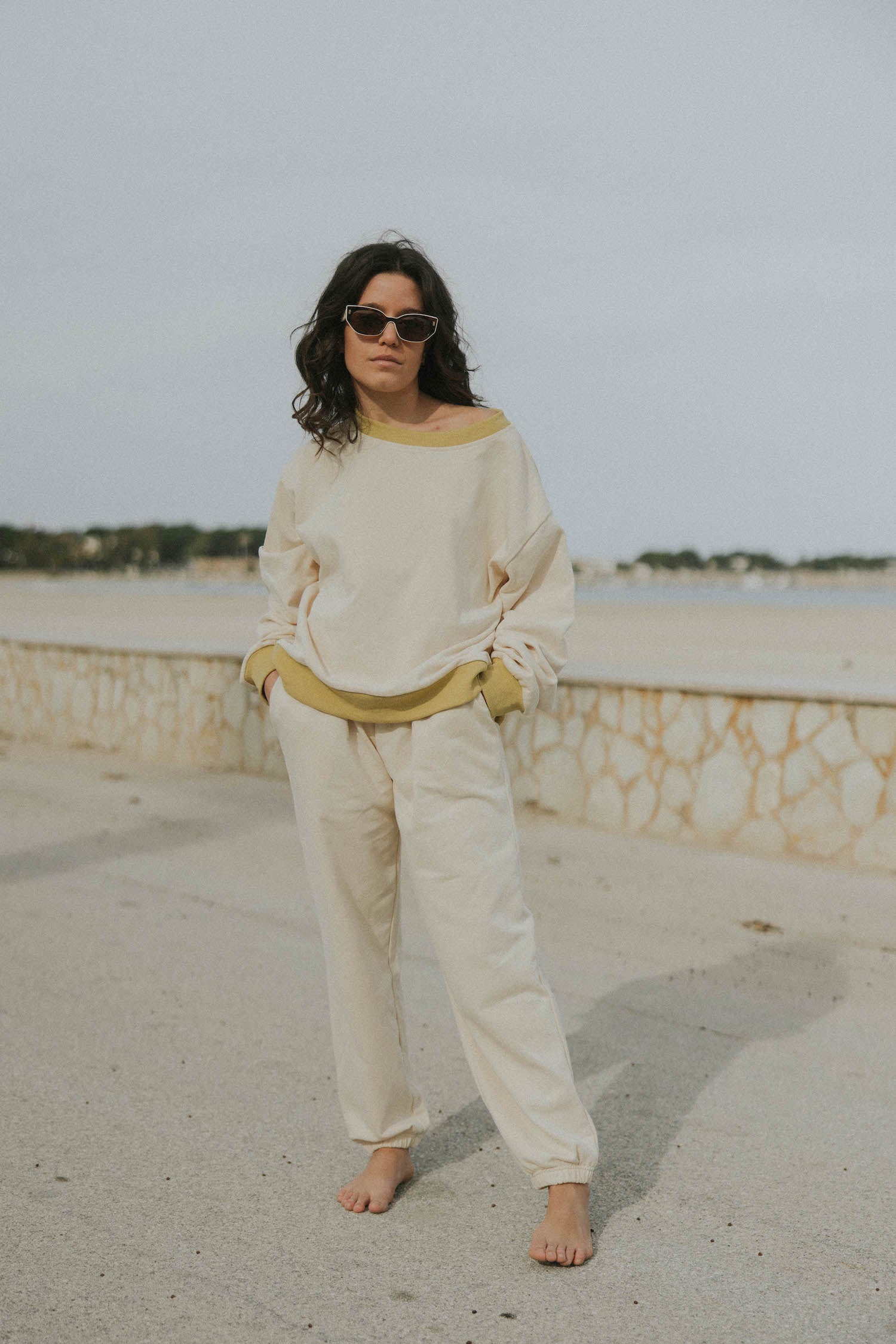 Matching neutral sweatsuit set for women.