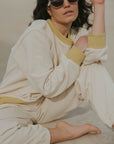 Matching neutral sweatsuit set for women.