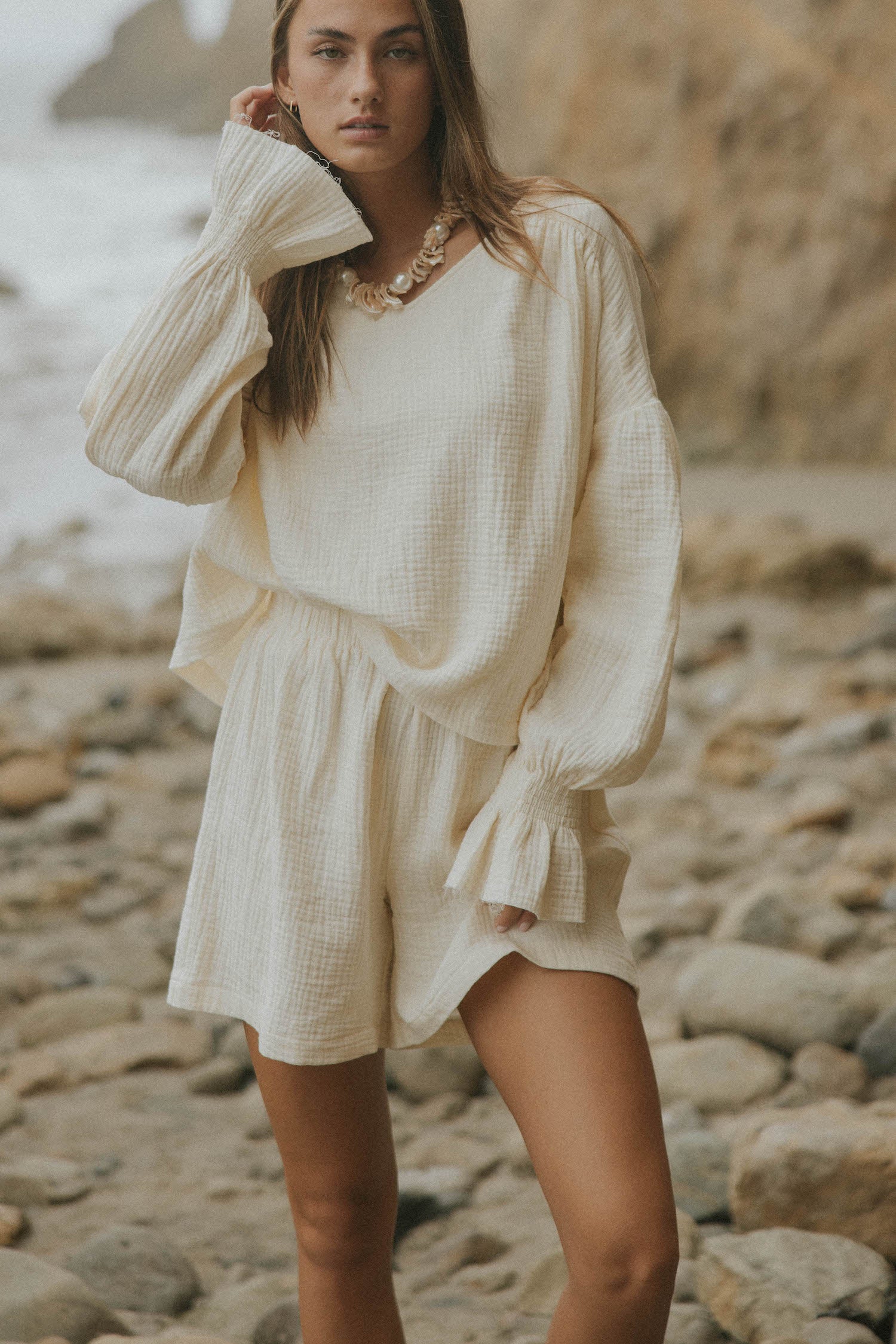 Mid-length muslin beach shorts for women in cream.