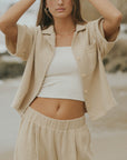 Brown muslin nursing-friendly top for women.