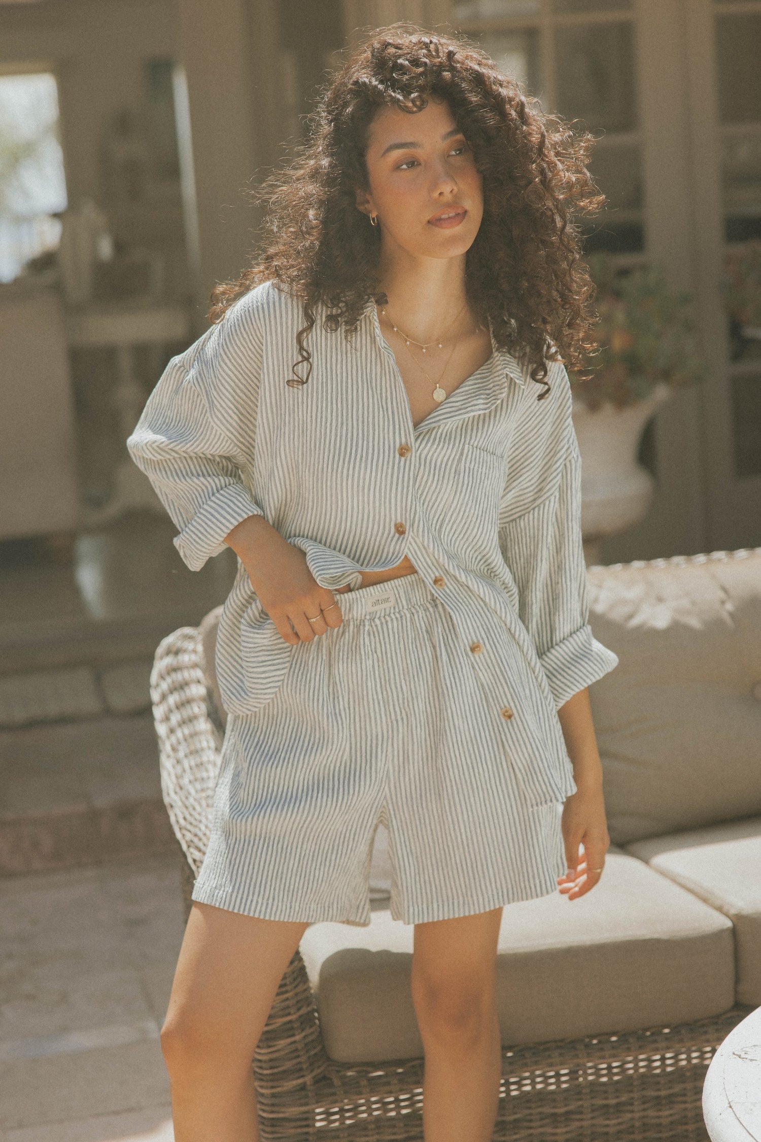 Striped matching shorts and top set for women.