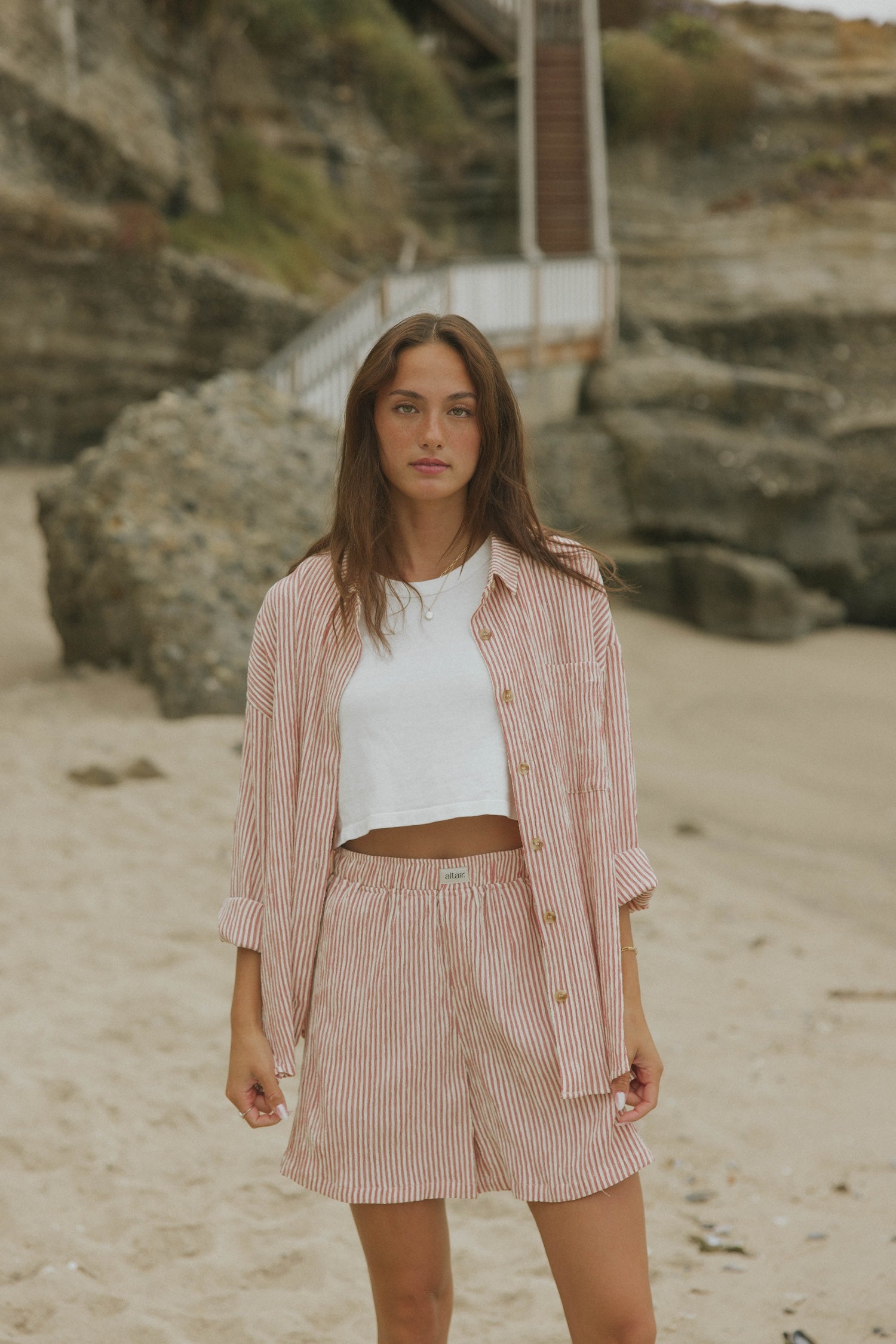 Striped matching shorts and top set for women.