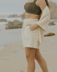 Neutral matching beachwear set for women.