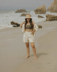 Neutral matching beachwear set for women.