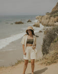 Neutral matching beachwear set for women.