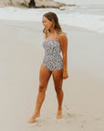 Cute modest one piece swimsuit, with ribbed texture and black and white cheetah print. Nursing Friendly 