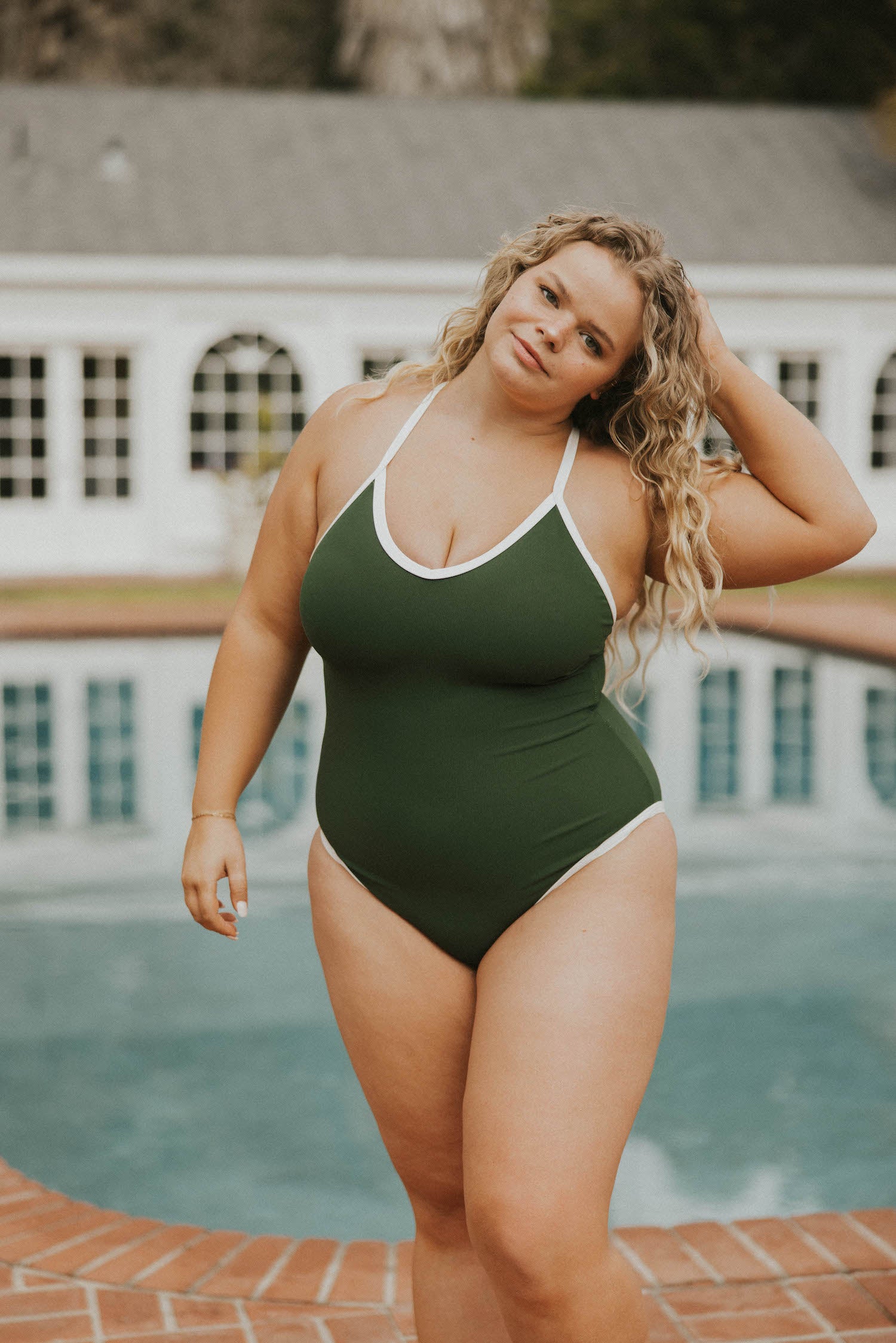 Women's dark green one piece swimsuit white trim